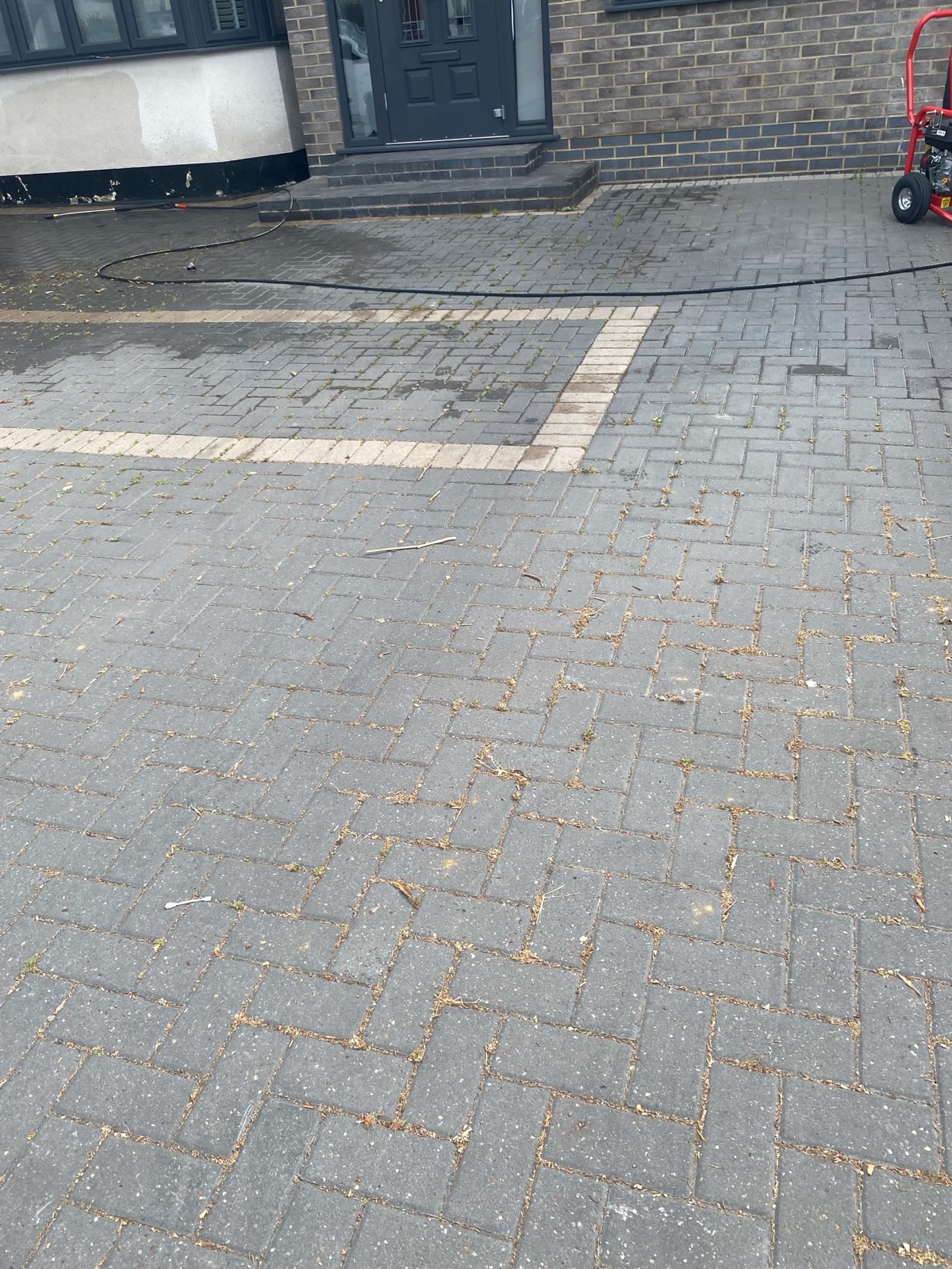 Driveway before jet wash cleaning